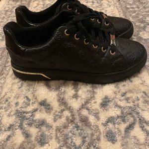 Guess black shoes with gold.